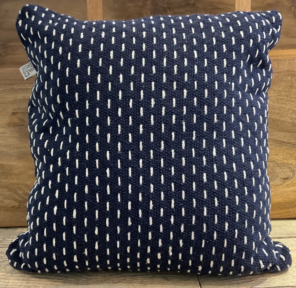 Woven cushion with stitch detail 