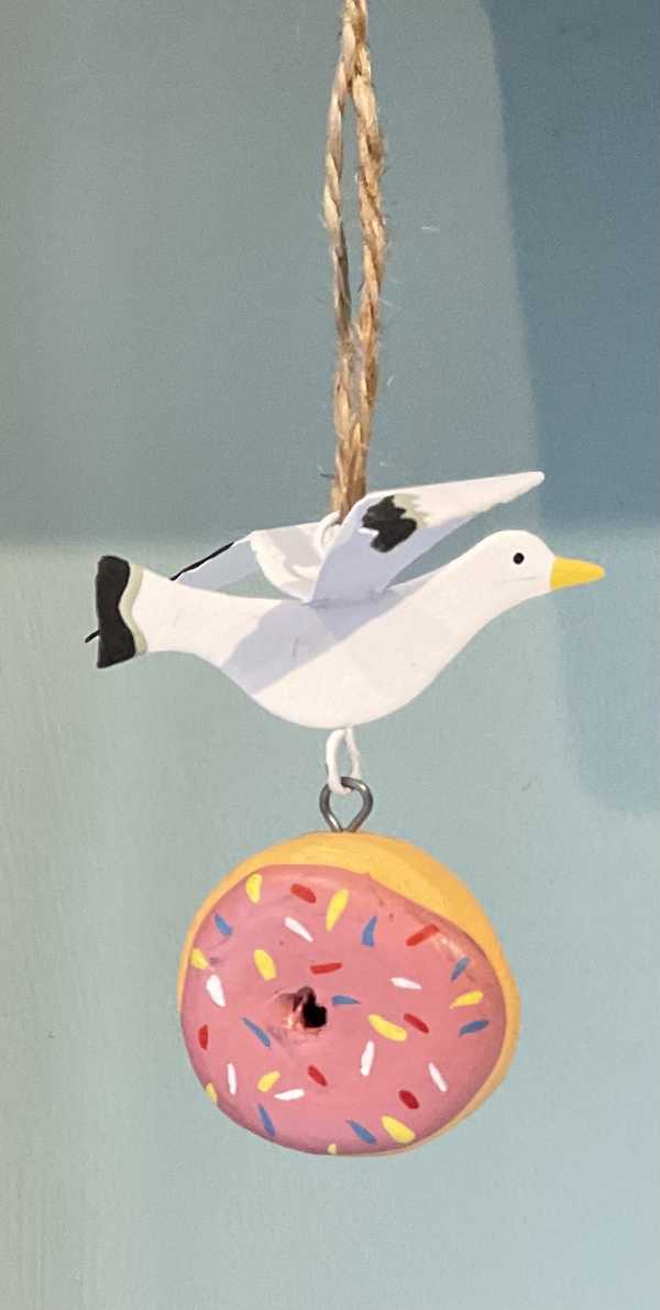Seagull stealing a donut hanging seaside decoration 