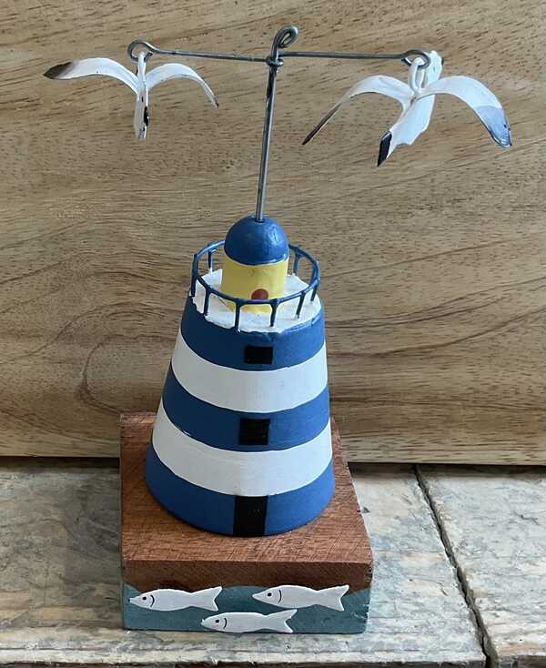 Wooden lighthouse decoration with seagulls and fish in blue 