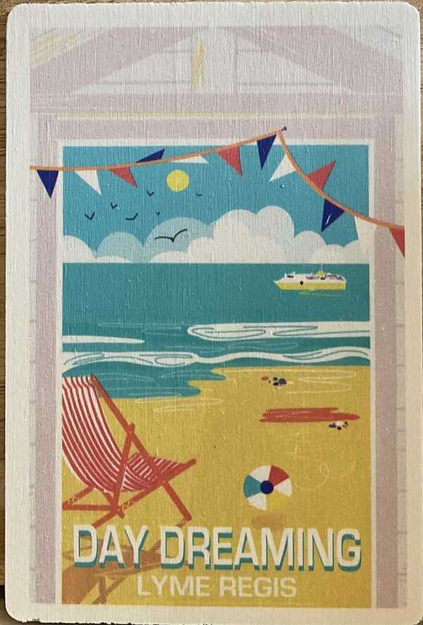 Day dreaming in Lyme Regis, wooden seaside postcard